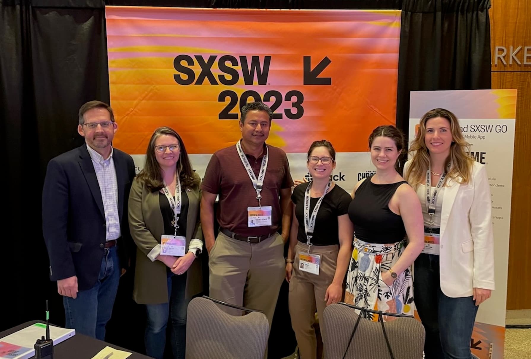 NASA Applied Sciences panel standing in front of a SXSW 2023 banner